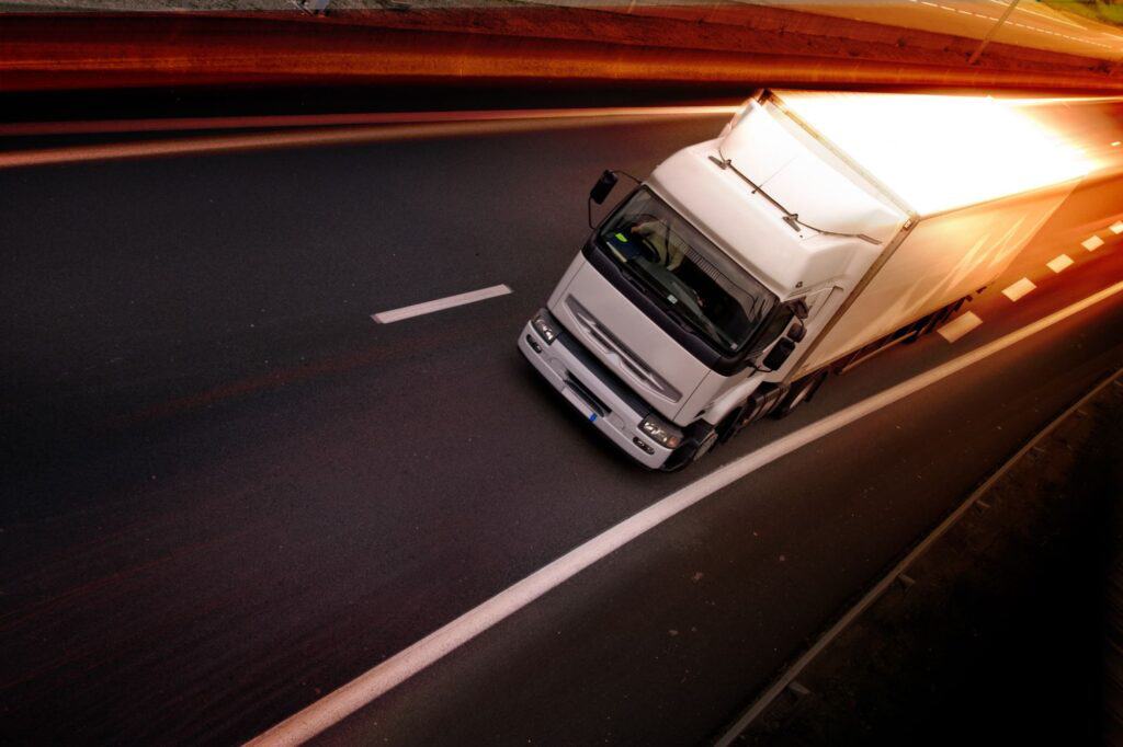 A speeding moving truck on the motorway