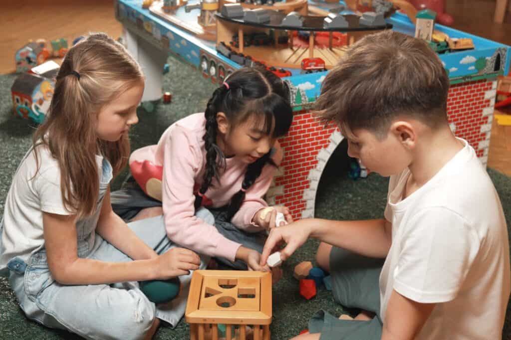 Students playing wooden blocks together