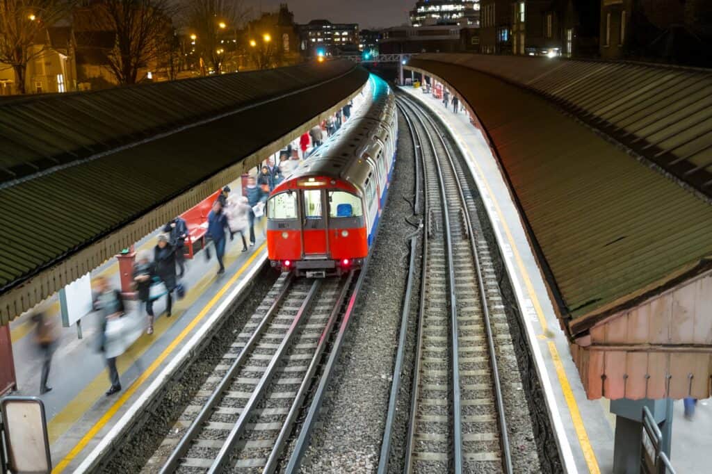 A train leaving a station after dropping off passengers