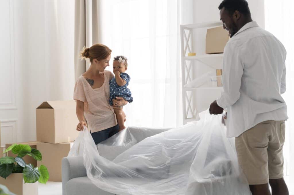 A young family packing in the living room for the move